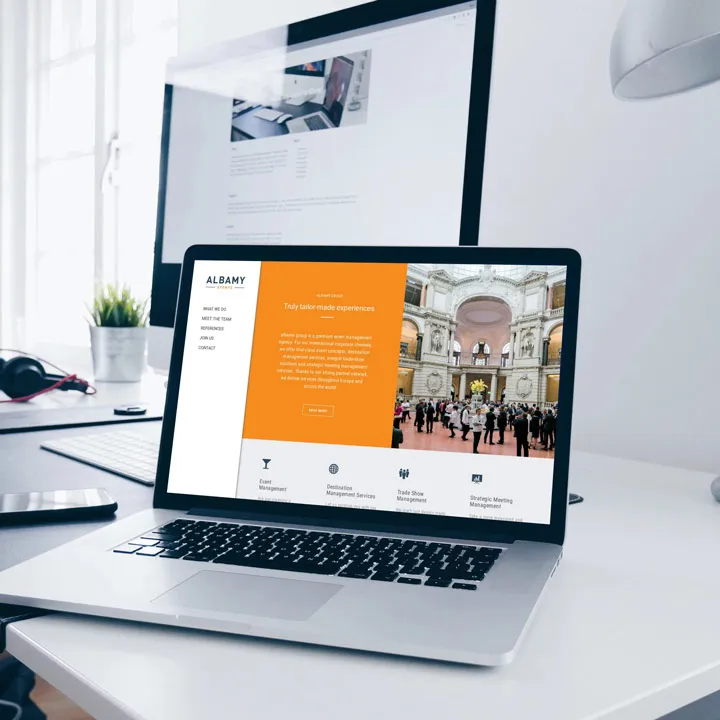 Albamy group homepage laptop mockup