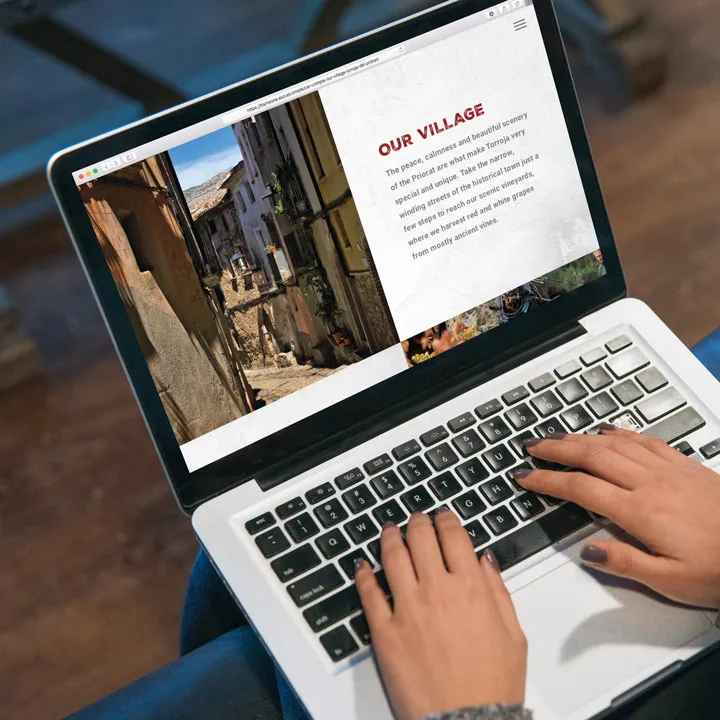 Cal compte priorat village page laptop mockup